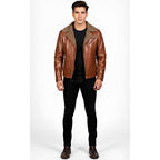 Man wearing a brown leather jacket with fur collar on a white background