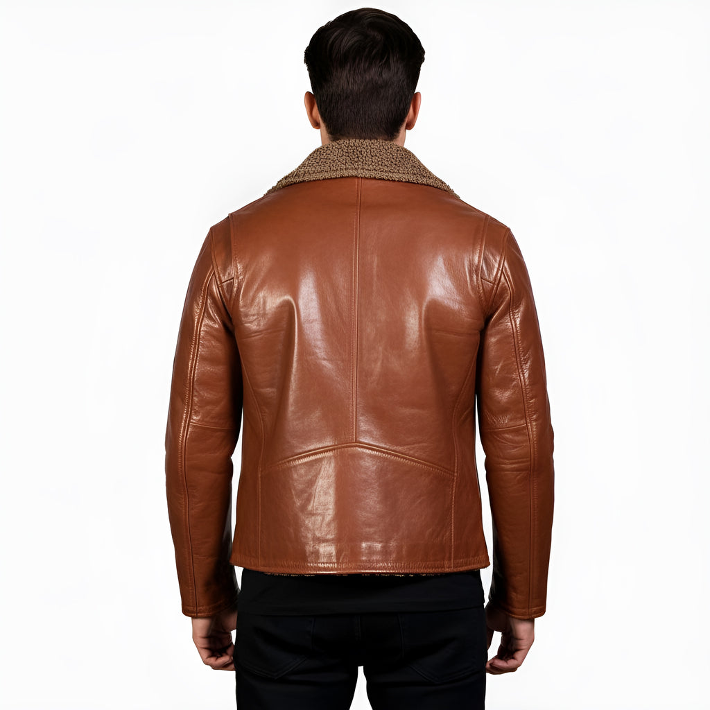 Brown leather jacket worn by a person on a white background