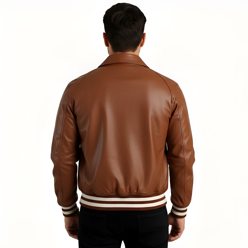 Brown leather jacket worn by a person on a white background