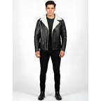 Man wearing a black leather jacket with white fur lining on a white background