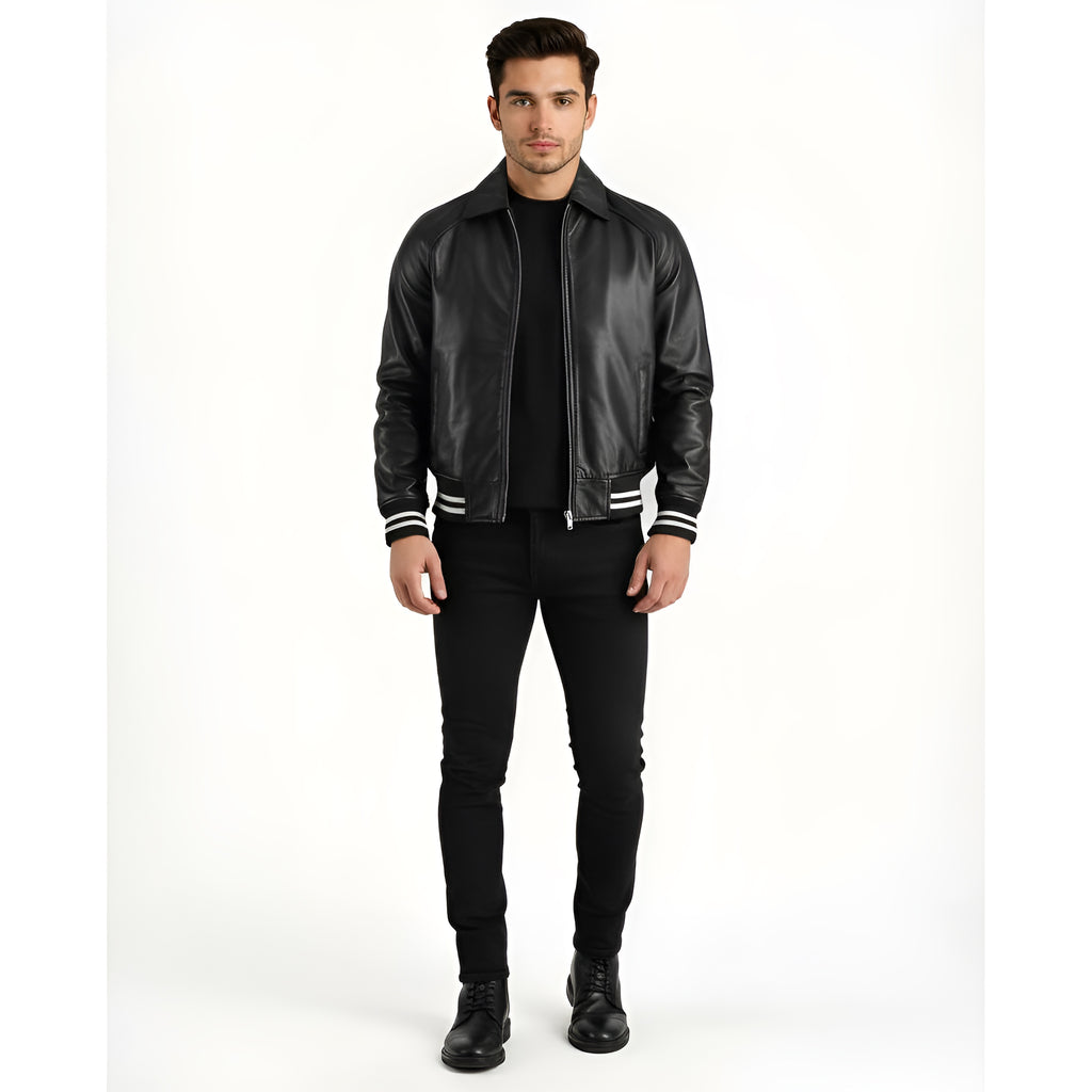 Man wearing a black leather jacket with white trim on a white background