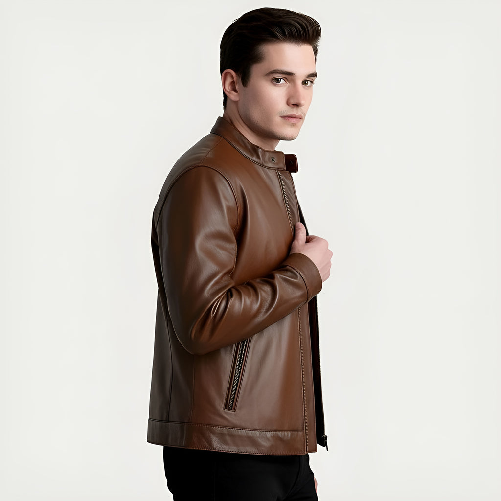 Man wearing a brown leather jacket on a light gray background