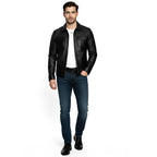 Man wearing a black leather jacket, white shirt, and blue jeans on a white background