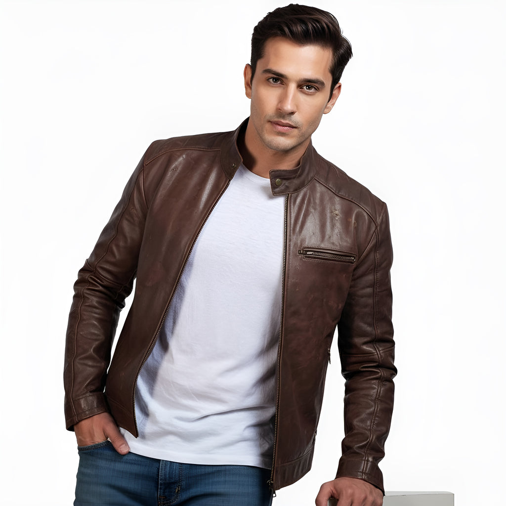 Man wearing a brown leather jacket over a white shirt on a white background