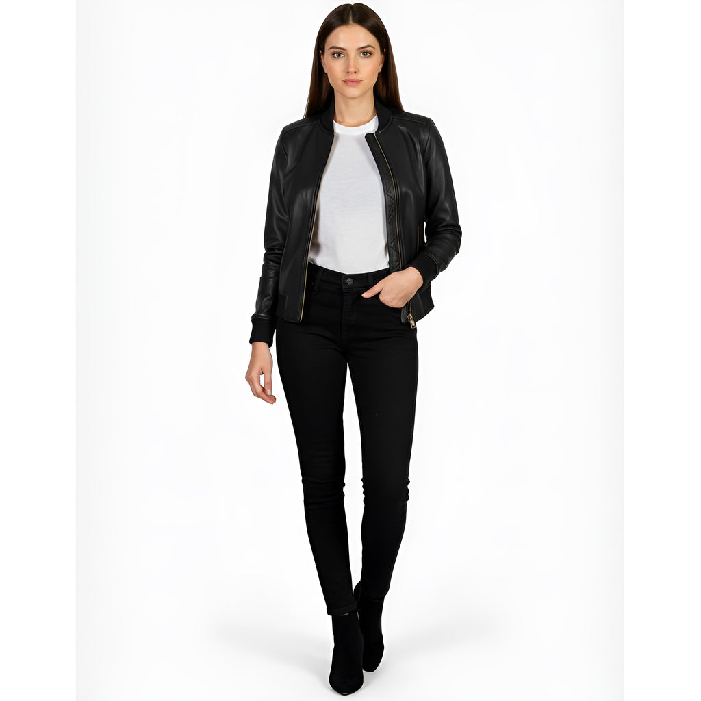 Woman wearing a black leather jacket, white shirt, and black pants on a white background