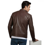 Man wearing a brown leather jacket on a white background