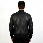 Man wearing a black leather jacket on a white background