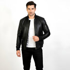 Man wearing a black leather jacket on a white background