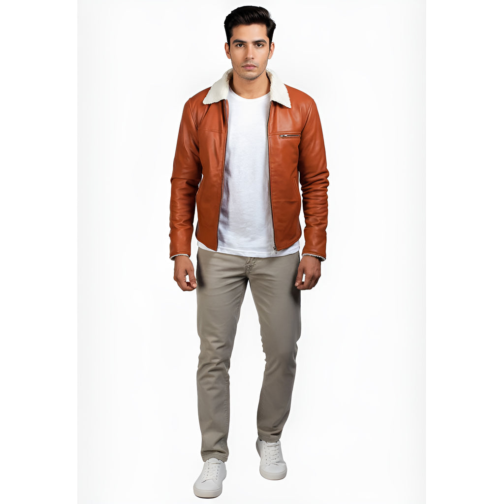 Man wearing a brown leather jacket with white shirt and beige pants on a white background