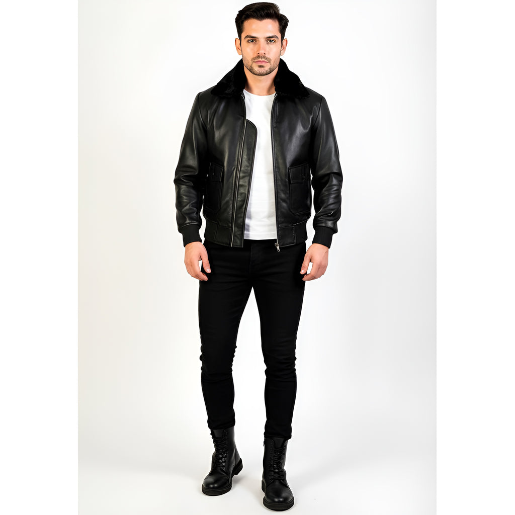 Man wearing a black leather jacket, white shirt, black pants, and black boots on a white background