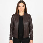 Woman wearing a brown leather jacket on a white background