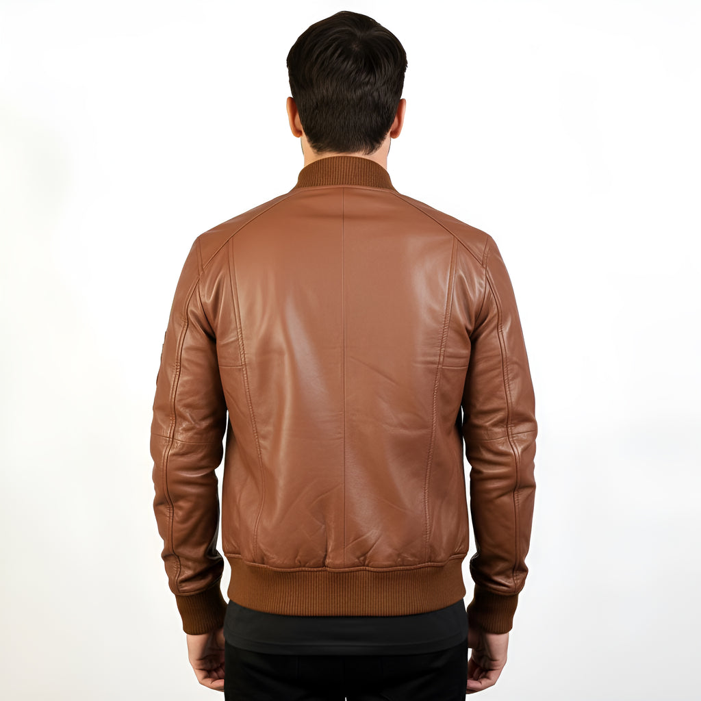 Brown leather jacket worn by a person on a white background