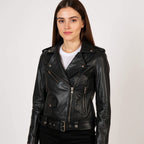 Woman wearing a black leather jacket on a white background