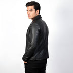 Man wearing a black leather jacket on a white background