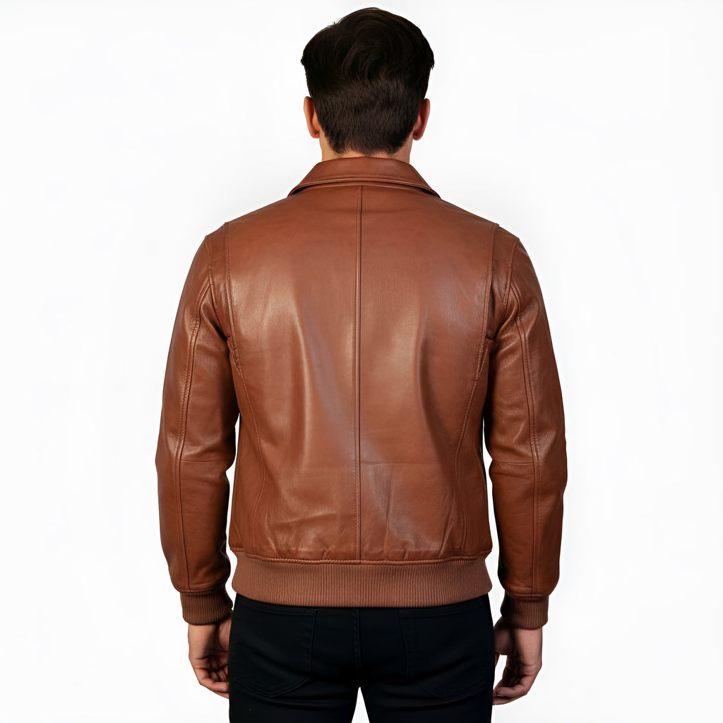 Brown leather jacket worn by a person on a white background