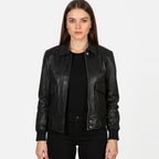 Woman wearing a black leather jacket on a white background