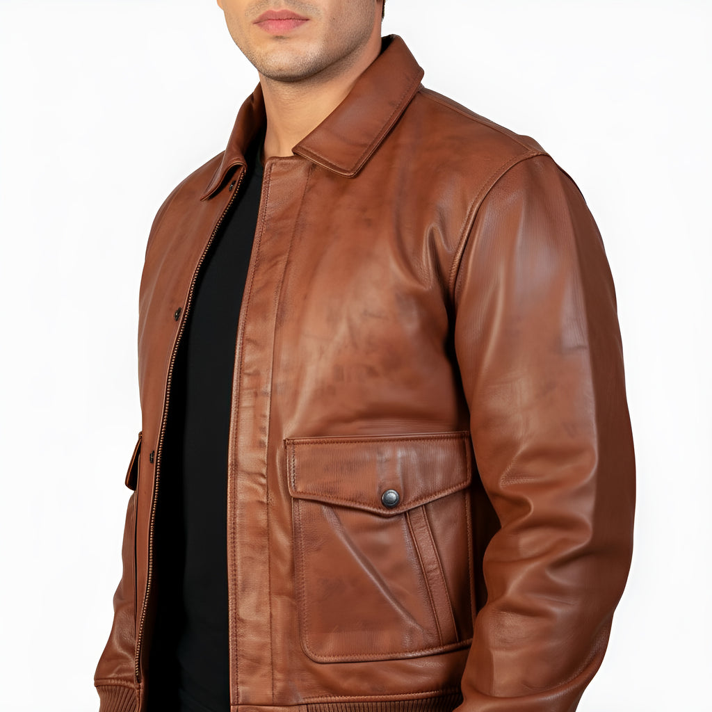 Brown leather jacket worn by a person on a white background