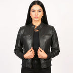 Woman wearing a black leather jacket on a white background