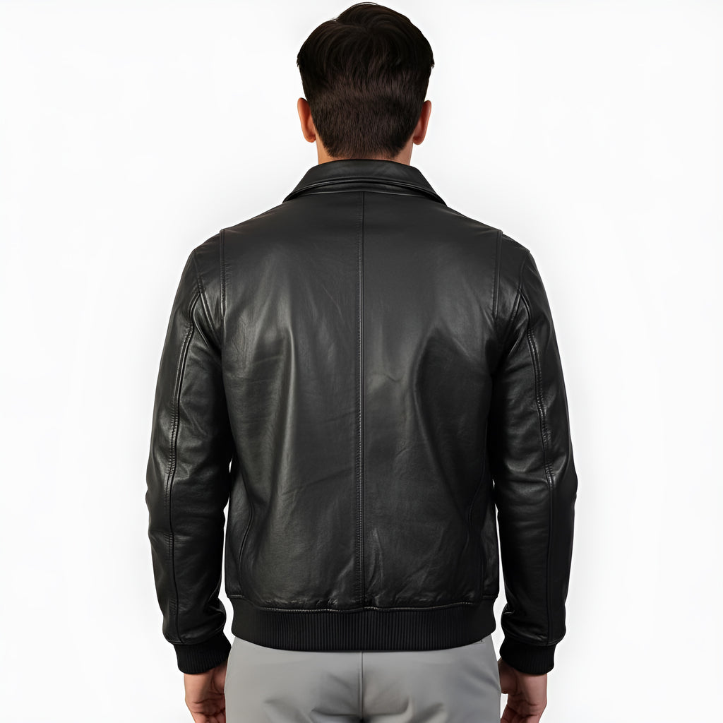 Black leather jacket worn by a person on a white background