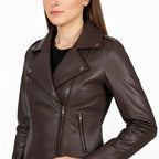Brown leather jacket worn by a person on a white background