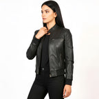 Woman wearing a black leather jacket on a white background