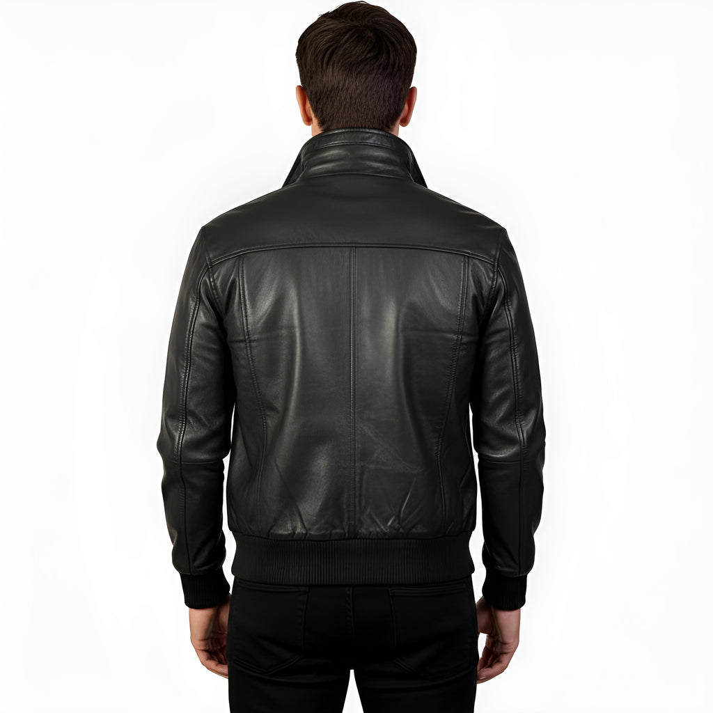 Black leather jacket worn by a person on a white background