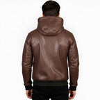 Brown leather jacket worn by a person on a white background