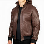 Brown leather jacket worn by a person on a white background