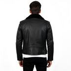 Black leather jacket worn by a person on a white background