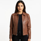 Woman wearing a brown leather jacket on a white background