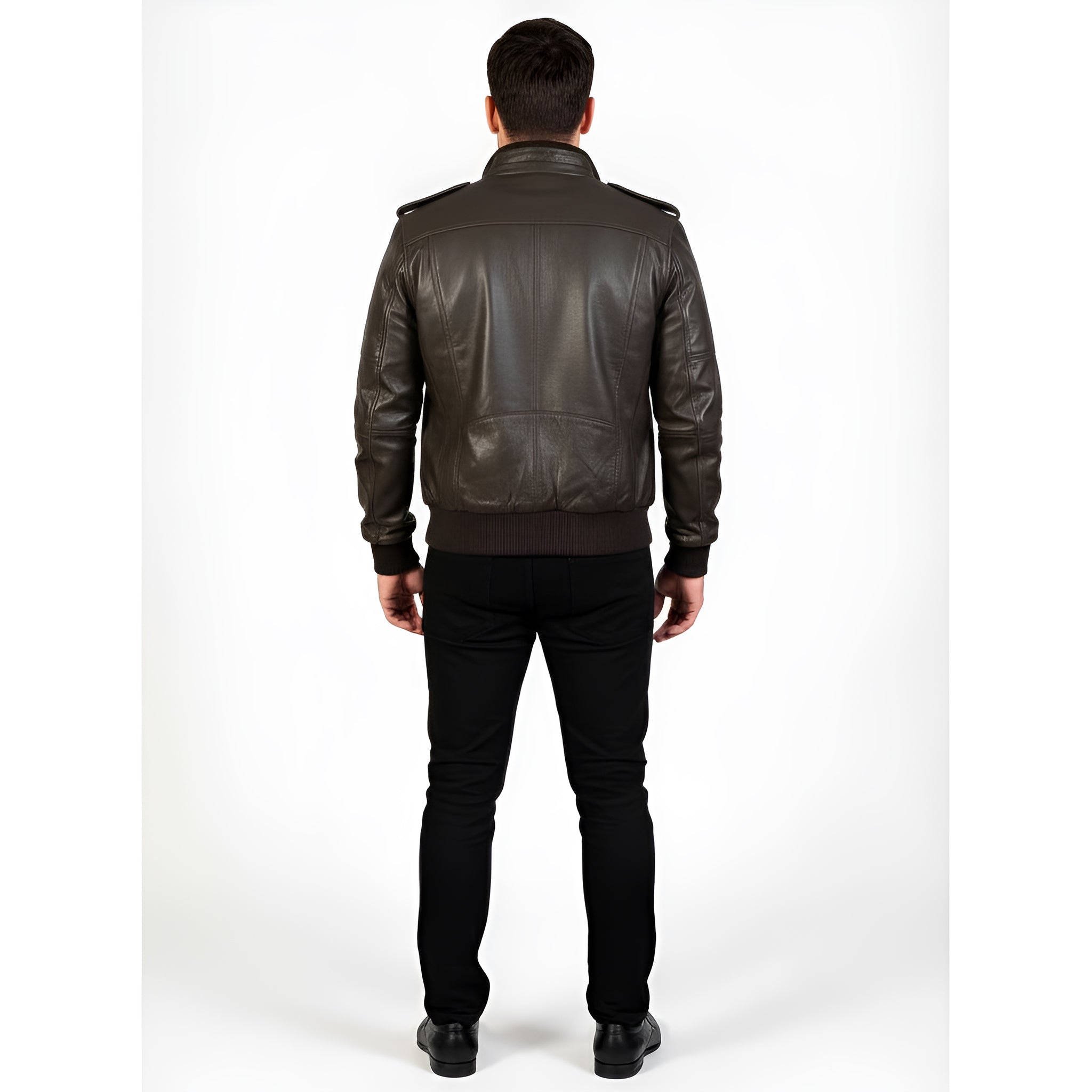 Man wearing a dark leather jacket and black pants on a white background