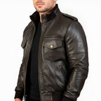 Brown leather jacket worn by a person on a white background